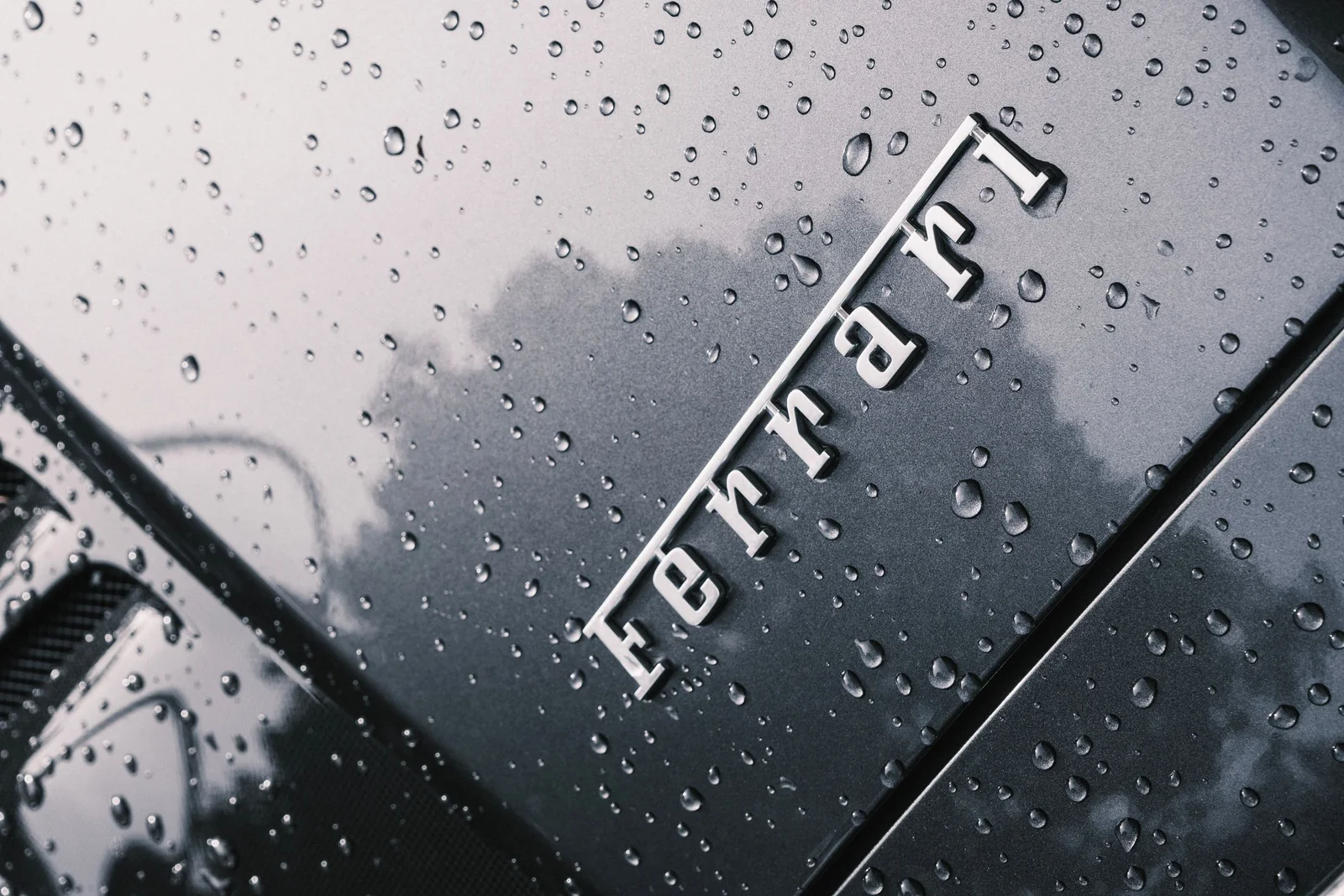 Water beading on glossy dark car paint