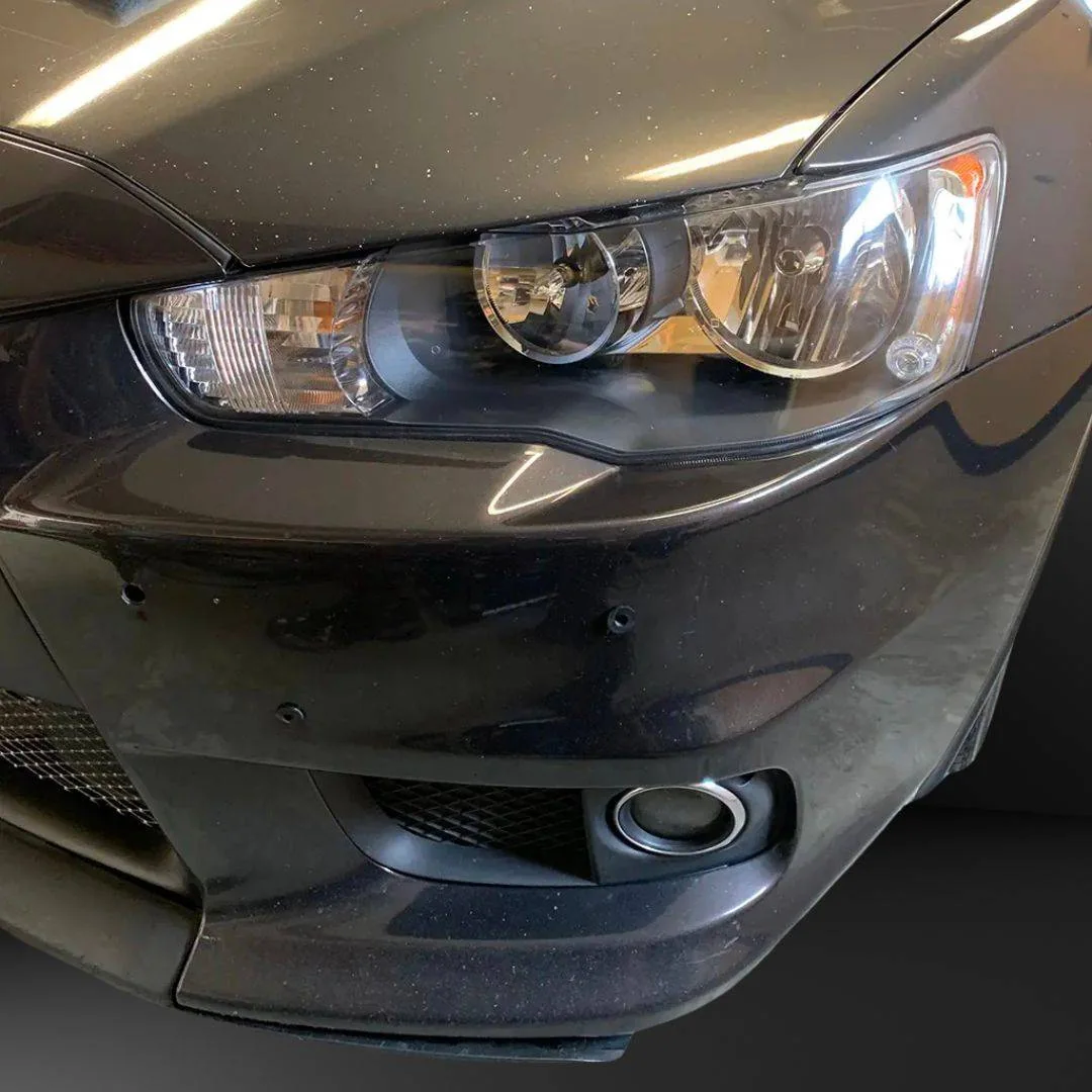 Clear, restored headlights on a dark car
