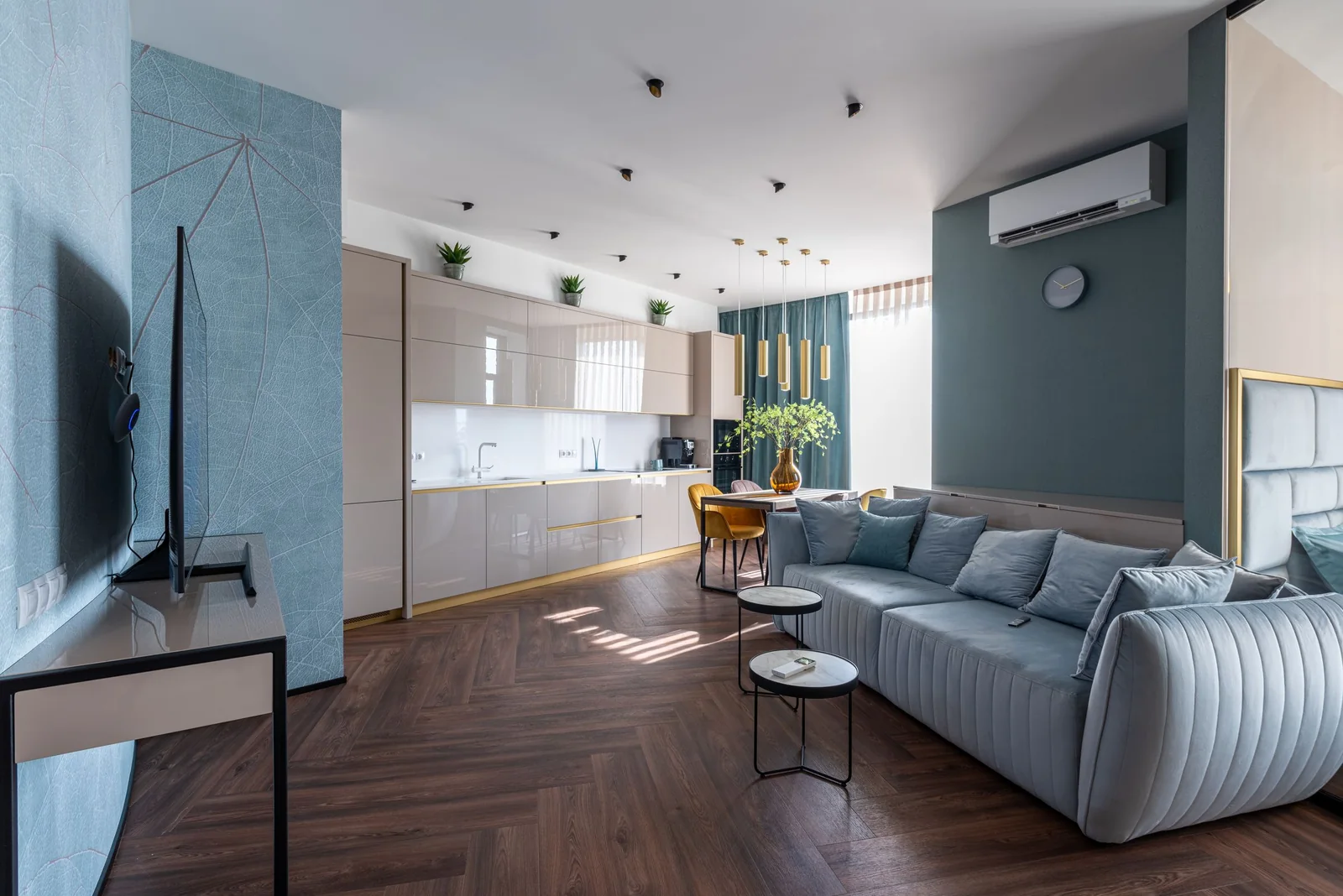 Sun across the wood floor of a bright living room