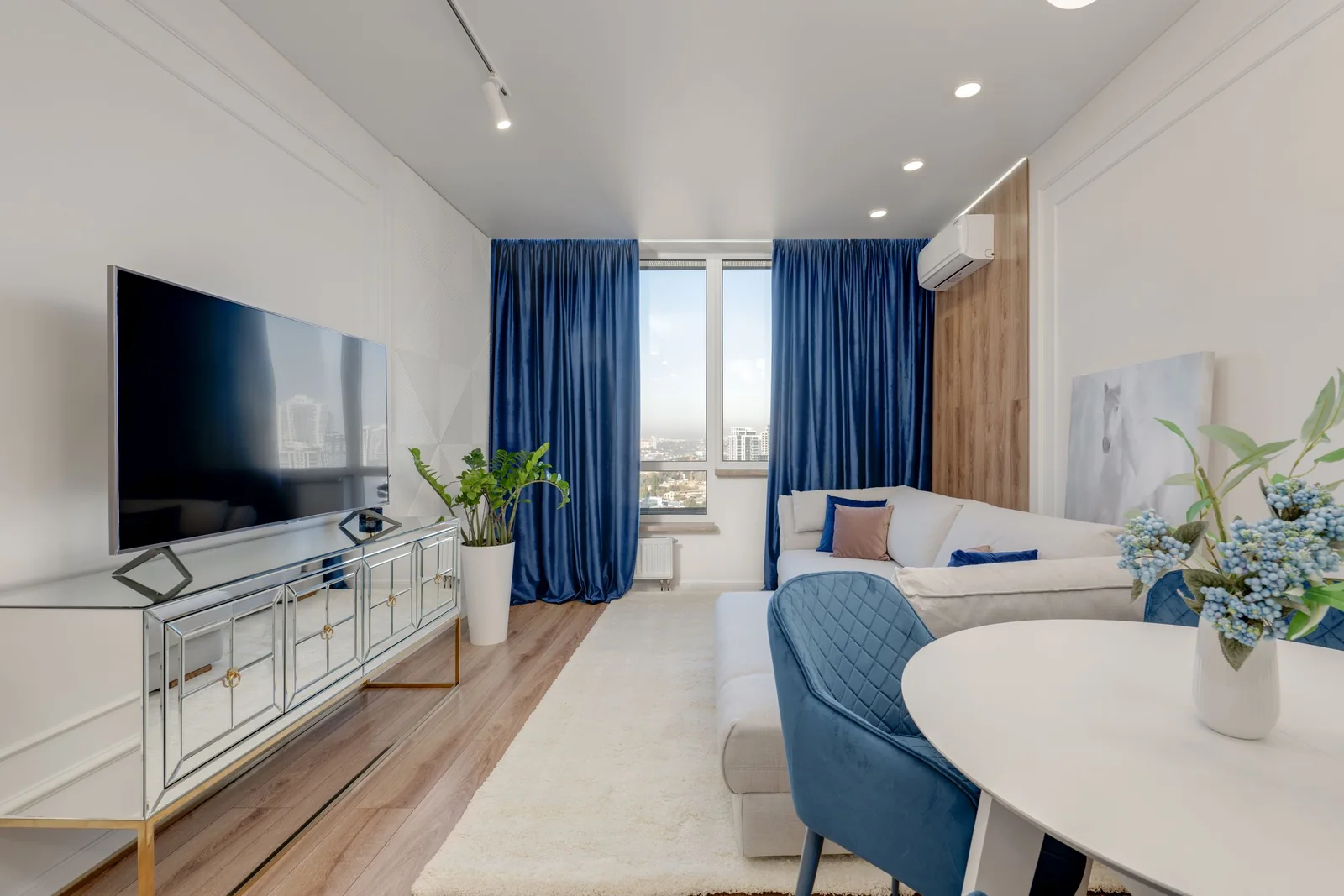 A bright living room with large windows